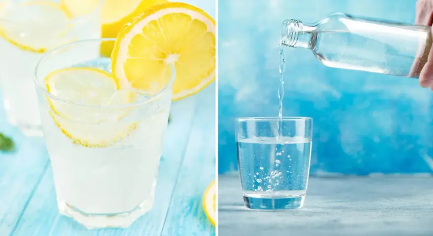 Frisk sodavatten till drinkar, med citron och is, hälls upp i ett glas.